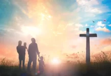 How Should a Born again Christian Live? A picture of a christian family standing infront of a cross
